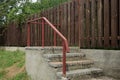 Gray concrete steps ir red iron handrails Royalty Free Stock Photo