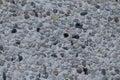 Gray concrete texture with small pebbles. Royalty Free Stock Photo