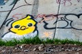 Graffiti wall with little yellow bird drawing