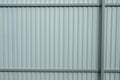 Gray corrugated metal fence. Part of the fence Royalty Free Stock Photo