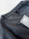 Gray cotton shirt with a blank label insulated by a white background