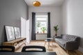 Gray couch and wooden cabinet