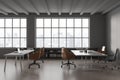 Gray coworking office interior with windows Royalty Free Stock Photo