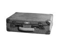 A gray, damaged, shabby suitcase with a white handle and metal corners on a white background. Black and white image Royalty Free Stock Photo