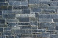 Gray decorative rough stone slab wall. Background texture. Royalty Free Stock Photo