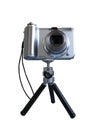 Gray digital photo camera on tripod isolated over white Royalty Free Stock Photo