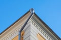 Gray drainpipe on the corner of the building Royalty Free Stock Photo
