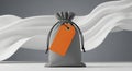 Gray drawstring bag with orange tag Royalty Free Stock Photo