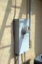 Gray electrical meter and panel on house Royalty Free Stock Photo