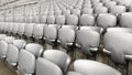 Gray empty chairs inside a soccer stadium Royalty Free Stock Photo