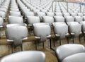 Gray empty chairs inside a soccer stadium Royalty Free Stock Photo