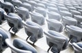 Gray empty chairs inside a soccer stadium Royalty Free Stock Photo