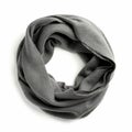 Gray fabric loop scarf displayed on a white background. Made from a soft material, it Royalty Free Stock Photo