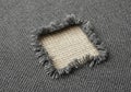 The cutout are frayed, exposing the texture and thread of the Royalty Free Stock Photo
