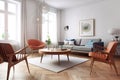 Gray fabric sofa and terra cotta chairs on parquet floor. Scandinavian style interior design of modern living room. Created with Royalty Free Stock Photo