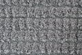 Gray fabric wool texture. Full frame detail of a loop heap gray carpet texture background.