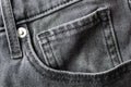 A gray fashion jeans denim front pocket details surface texture background close up Royalty Free Stock Photo