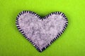 Gray felt heart on a green background, Royalty Free Stock Photo