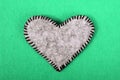 Gray felt heart on a green background, Royalty Free Stock Photo