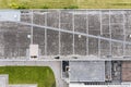 Gray flat roof of an industrial building or warehouse. aerial view