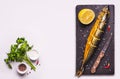 Gray food background with Smoked mackerel fish and spices Royalty Free Stock Photo