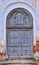 Gray fortress door in the wall, wooden door Royalty Free Stock Photo