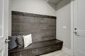 Gray Foyer features Half wood plank accent wall