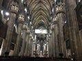 Gray gloomy tall columns inside Milan Cathedral in Italy in winter 2017
