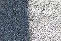 Gray granite pebble texture divided by shadow.