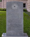 Gray granite slab standing on the grounds of the Tarrant County Courthouse paying tribute to the county`s fallen fire fighters.