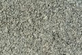 Gray granite texture. Grained stone grunge background. Closeup Royalty Free Stock Photo