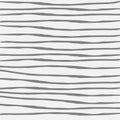 Gray graphic horizontal stripes drawn with a brush on a light background