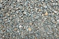 Gray gravel stone wallpaper background backdrop. Concrete rough grunge industrial texture pattern. Royalty Free Stock Photo