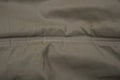 Gray green fabric texture from crumpled piece of clothing Royalty Free Stock Photo