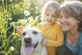 Gray-haired grandmother and cute little granddaughter are walking their dogs together in the park Royalty Free Stock Photo