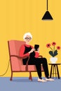 Gray-haired granny relaxing in an armchair at home with a tablet