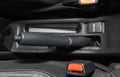 Gray Hand Brake and Seatbelt Lock Inside Car