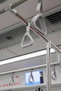 The gray hanging handhold use for standing passengers in a modern metro or train. Royalty Free Stock Photo