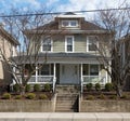 Gray House in Urban Setting with Bare Winter Trees