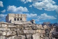 Gray iguana sitting on the stone wall of Mayan Ruins of The Castle in Tulum, Riviera Maya, Yucatan, Caribbean Sea, Mexico Royalty Free Stock Photo