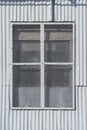 Gray iron grille window with zinc wall exterior Royalty Free Stock Photo