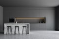 Gray kitchen with countertops and bar Royalty Free Stock Photo