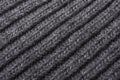 Gray knitted fabric texture close up. Can be used as a background. Selective focus Royalty Free Stock Photo