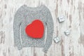 Gray knitted sweater, red heart shaped and silver gift boxes. Fa Royalty Free Stock Photo