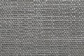 Gray knitted woolen background with a pattern of soft, fleecy cloth. Texture of textile closeup Royalty Free Stock Photo