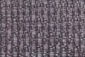 Gray knitted woolen background with a pattern of soft, fleecy cloth. Texture of textile closeup. Royalty Free Stock Photo