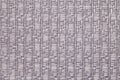 Gray knitted woolen background with a pattern of soft, fleecy cloth. Texture of textile closeup. Royalty Free Stock Photo