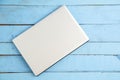Gray laptop on a blue wooden background. the view from the top Royalty Free Stock Photo