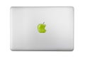 Gray laptop and green apple isolated on white background Royalty Free Stock Photo