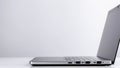 Gray laptop on white isolated background, side view